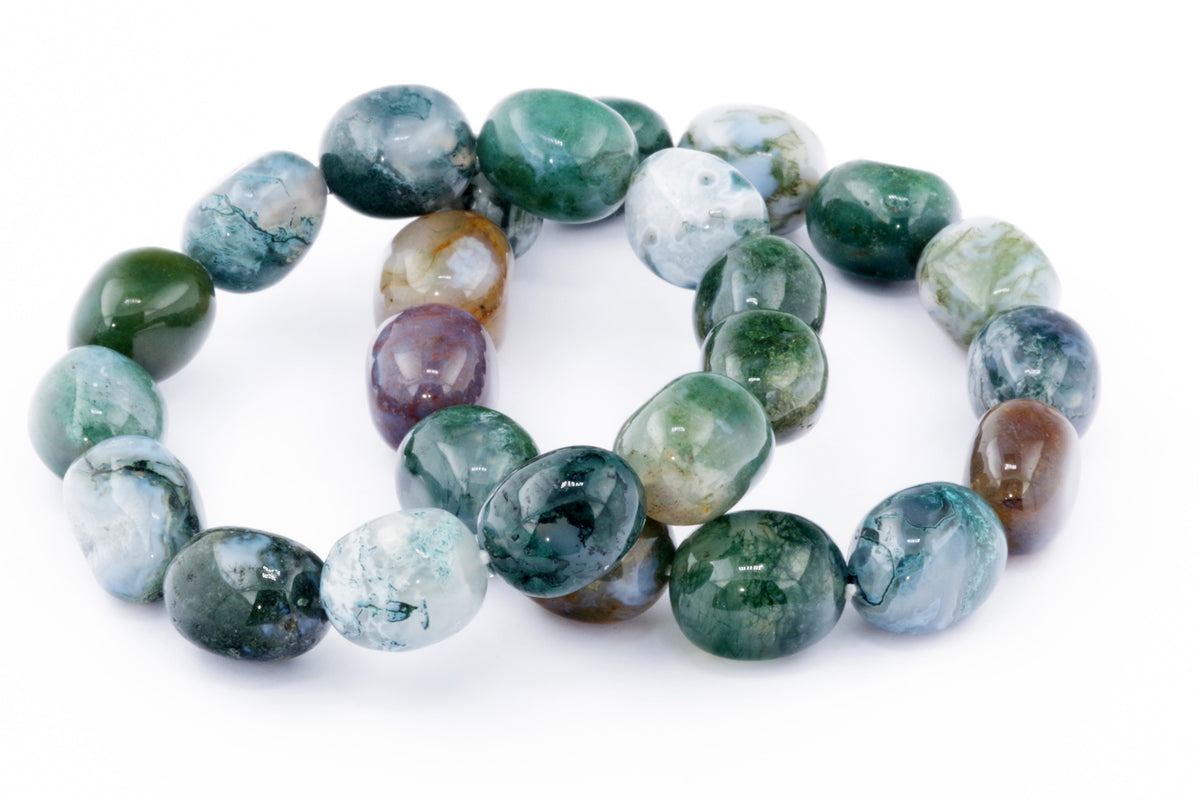 Close-up of polished natural crystals in a beaded loop, showcasing subtle green and earthy tones in the Moss agate bracelet – Gem, ideal for crystal jewellery and healing collections.