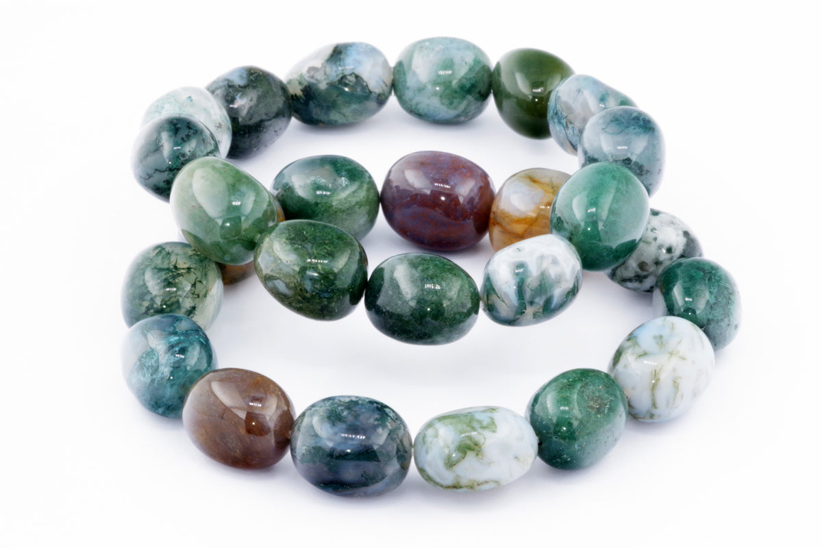 Moss agate bracelet – Gem featuring polished natural crystals in varying shades of green, white, and brown, showcasing unique patterns and smooth textures for crystal jewellery enthusiasts.