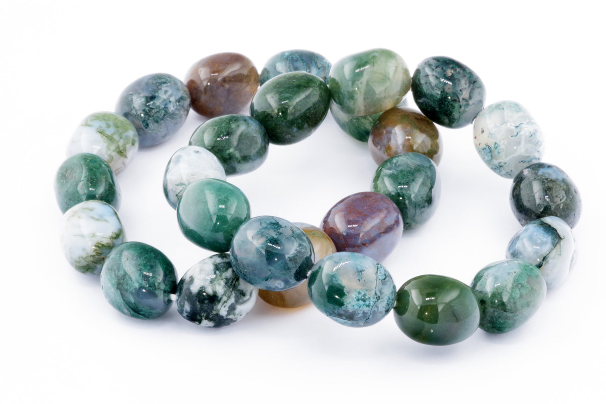 Close-up of smooth polished Moss agate beads in green, blue, brown, and white tones, arranged in a bracelet form showcasing natural crystals and gemstones Moss agate bracelet – Gem.