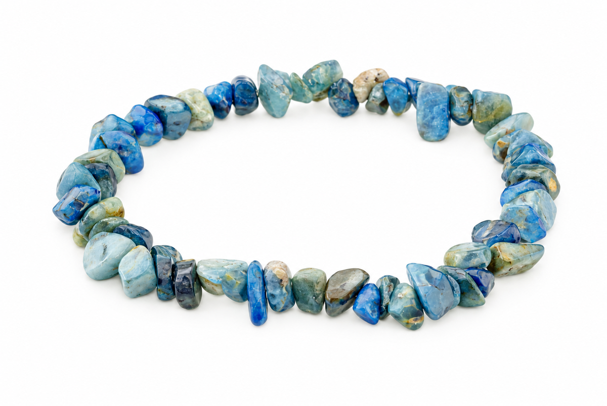 Apatite bracelet with irregular chips in shades of blue, green and grey on a white background.