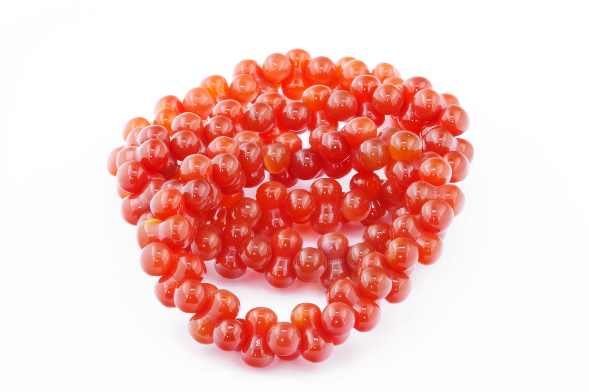 Carnelian bracelet – DNA featuring polished natural carnelian gemstones with a vibrant orange-red hue, perfect for crystal jewellery and healing crystal collections.