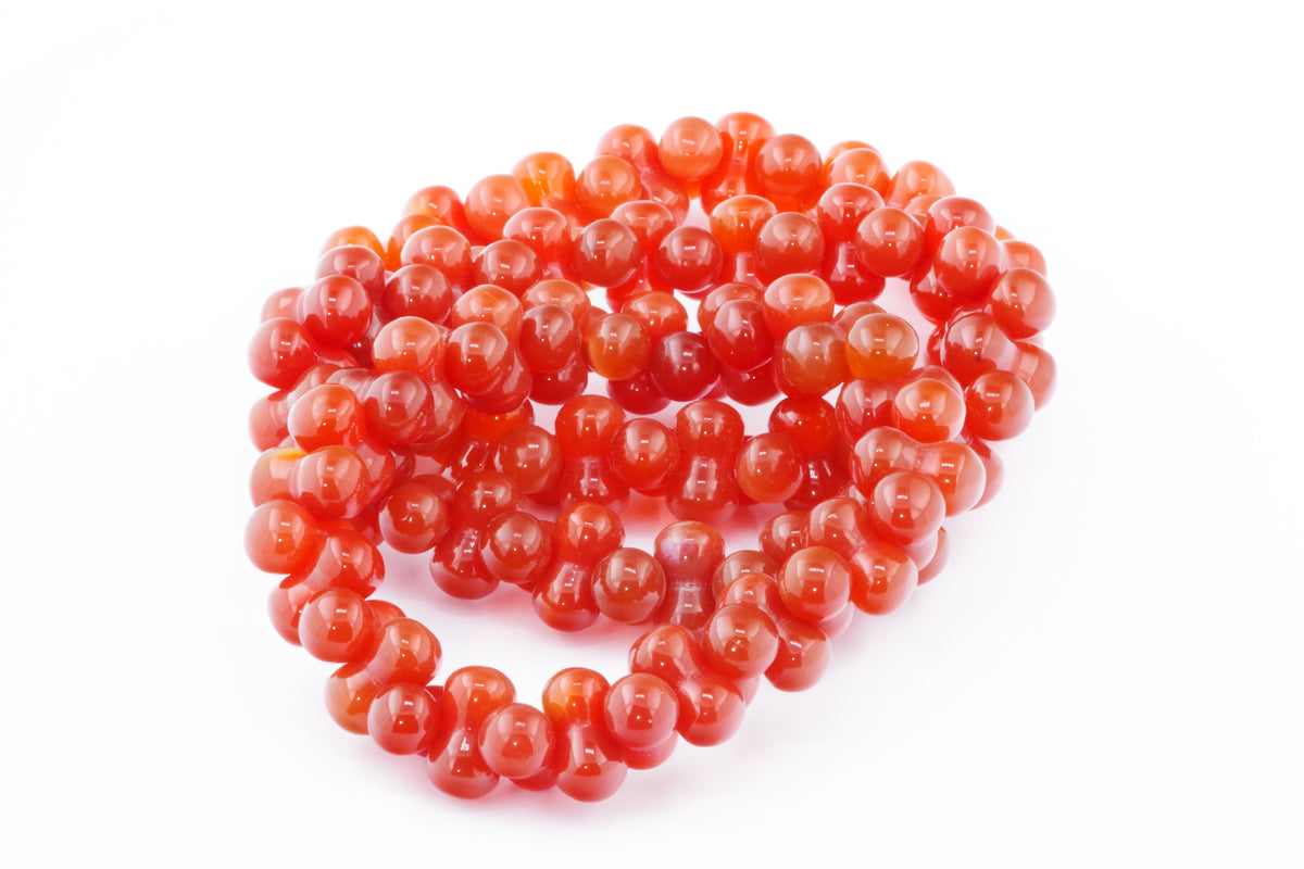 Carnelian bracelet – DNA featuring polished deep orange-red carnelian crystal beads, arranged in a continuous strand designed for healing and energy enhancement.