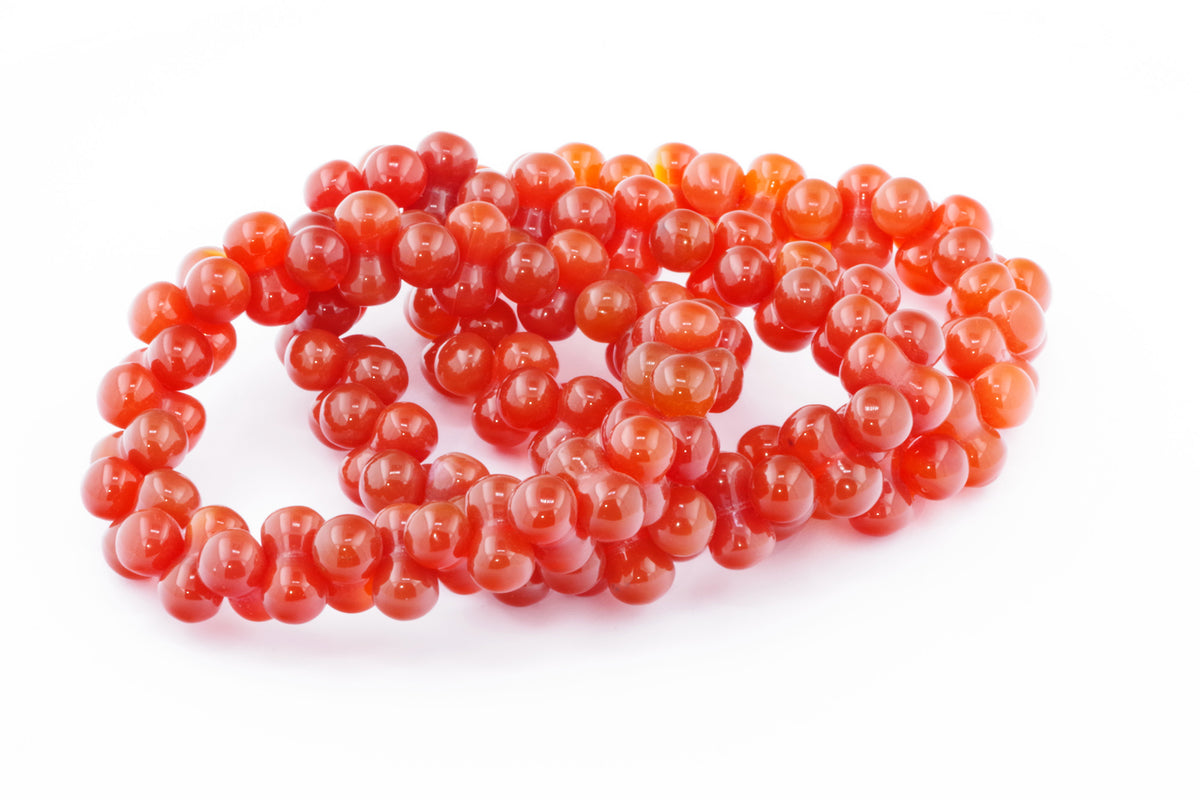 Carnelian bracelet – DNA featuring polished natural carnelian gemstone beads in rich orange-red hues, designed as elegant crystal jewellery for energy and grounding.