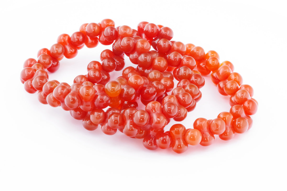 Carnelian bracelet – DNA featuring polished natural carnelian gemstones with a rich orange-red hue, designed as a unique crystal bracelet for healing and energy.