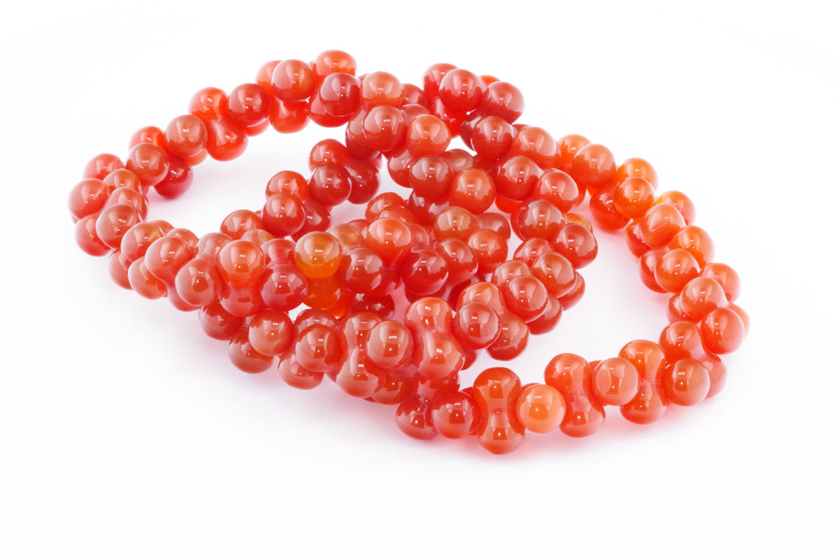 Carnelian bracelet – DNA featuring polished orange-red natural crystals arranged in a unique beaded design, ideal for crystal jewellery and healing crystals collections.