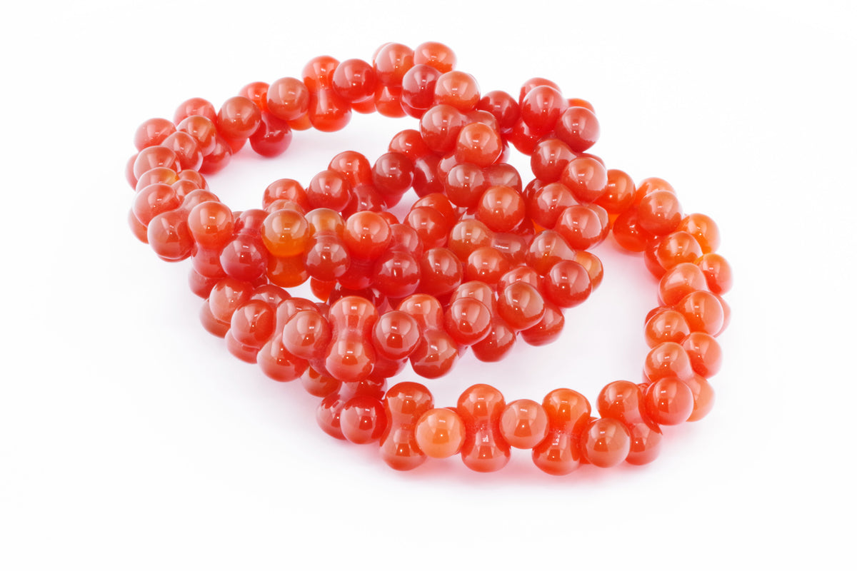 Carnelian bracelet – DNA featuring polished round orange-red natural crystal beads, designed as a healing crystal bracelet for energy and grounding.
