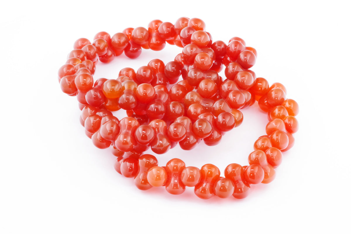 Carnelian bracelet – DNA featuring polished, vibrant orange natural carnelian crystals arranged in a unique, DNA-inspired pattern for crystal jewellery lovers.