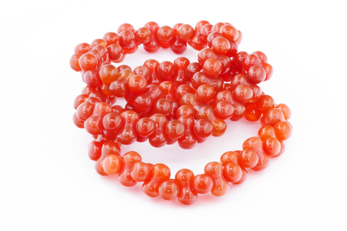 Carnelian bracelet – DNA featuring polished natural carnelian gemstones in a unique beaded design, ideal for crystal jewellery lovers and healing crystal collectors.