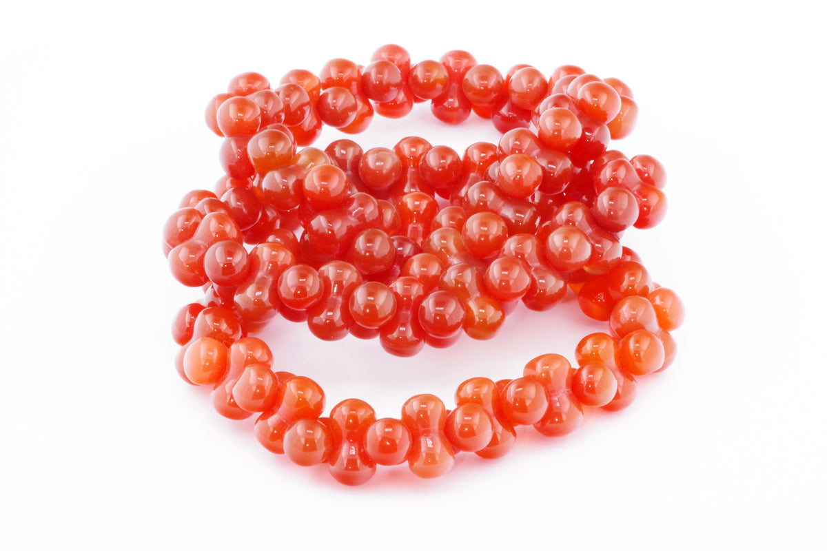 Carnelian bracelet – DNA featuring polished natural carnelian beads with a vibrant orange-red hue, perfect for crystal jewellery and healing crystal collections.