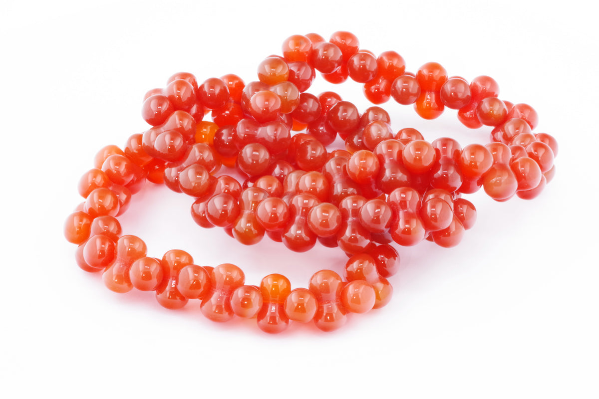 Carnelian bracelet – DNA featuring polished deep orange natural carnelian crystal beads arranged in a unique double helix shape, perfect for crystal and gemstone enthusiasts.
