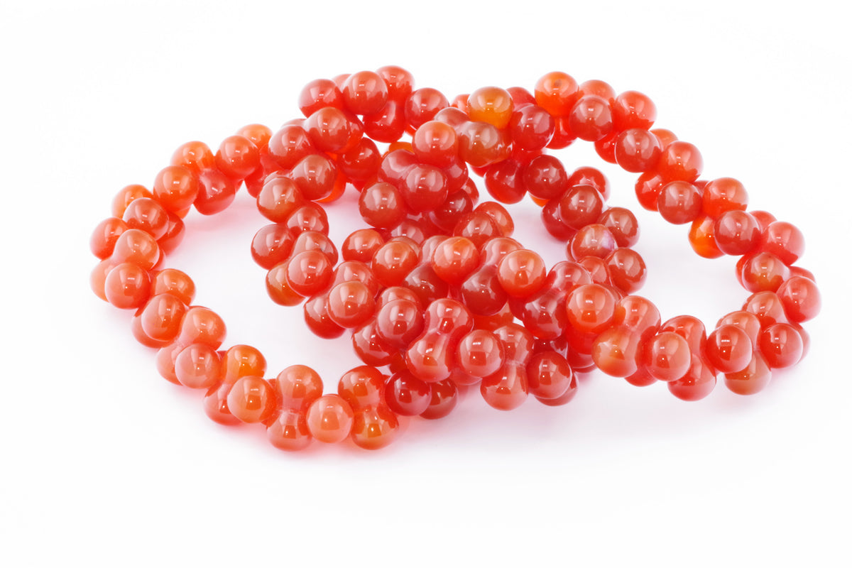 Carnelian bracelet – DNA featuring smooth, polished natural carnelian crystal beads in rich orange-red tones, ideal as gemstone jewellery with healing crystal properties.