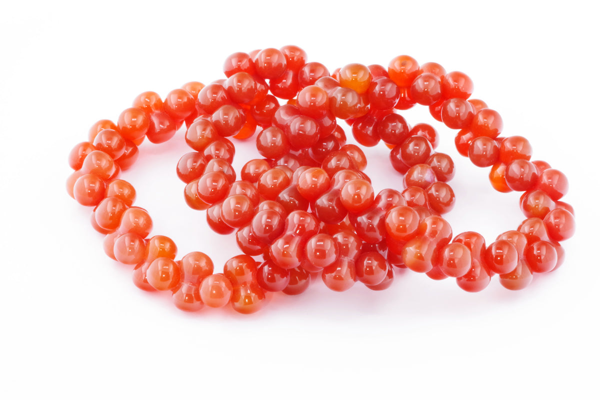 Carnelian bracelet – DNA featuring polished natural carnelian crystal beads in rich orange-red hues, designed as a stylish and healing crystal bracelet accessory.