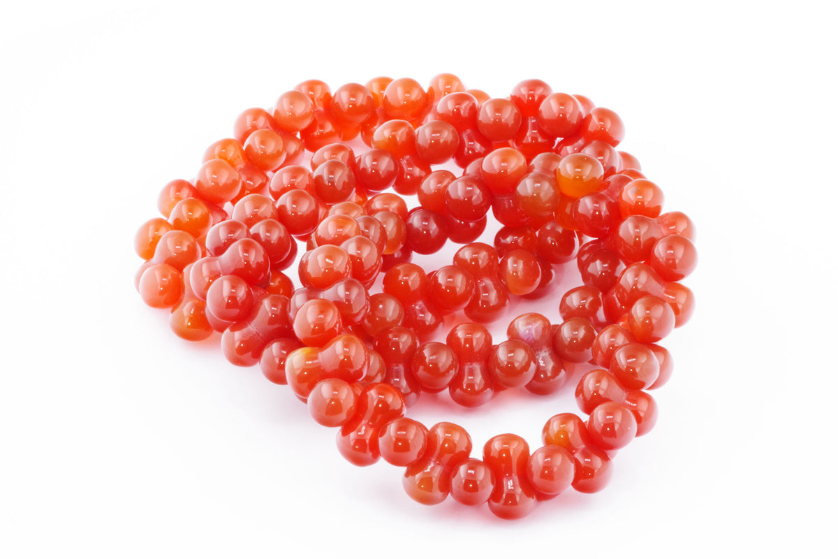 Carnelian bracelet – DNA featuring polished natural carnelian crystal beads in vibrant shades of orange and red, perfect for crystal jewellery lovers and healing crystals enthusiasts.