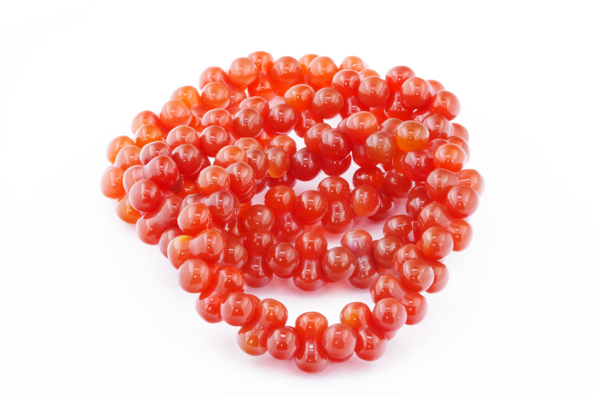 Carnelian bracelet – DNA featuring polished natural carnelian crystal beads with warm orange-red hues, ideal for crystal jewellery and healing crystal collections.