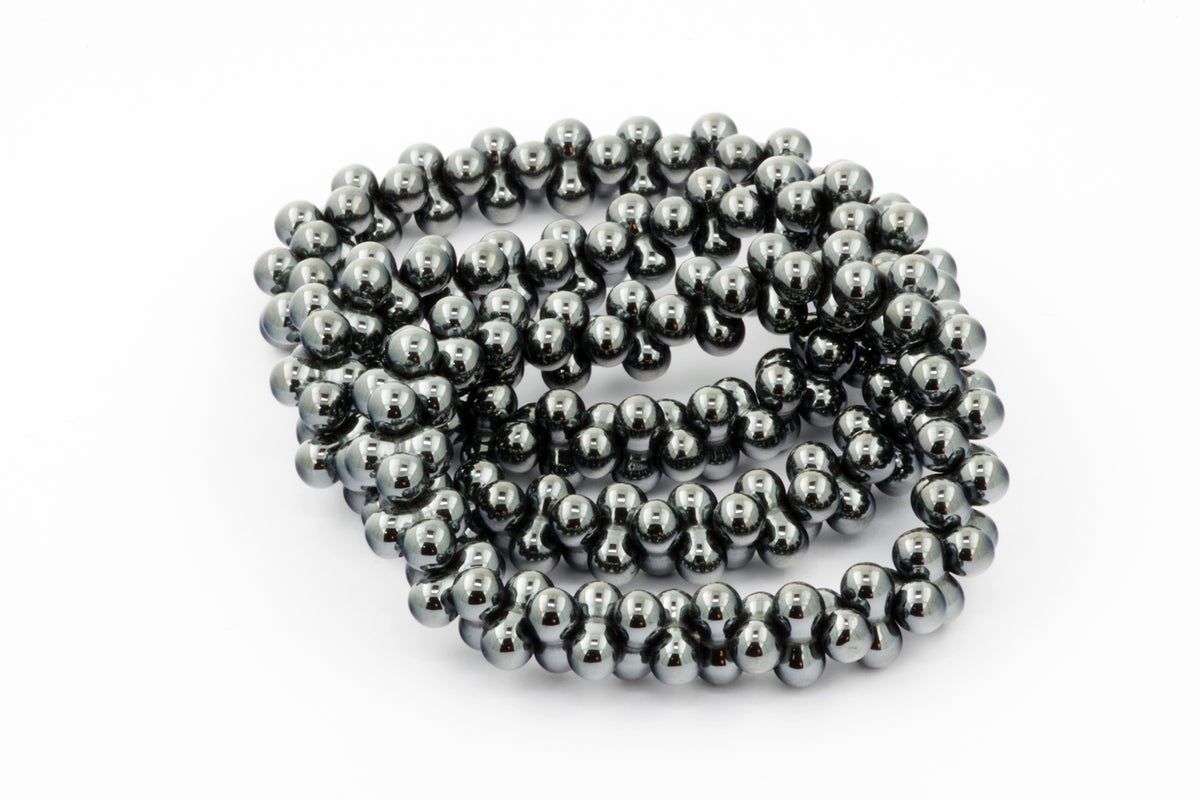 Hematite bracelet – DNA made of polished natural hematite beads with a smooth, reflective surface, designed as a stylish crystal bracelet for grounding and energy balancing.