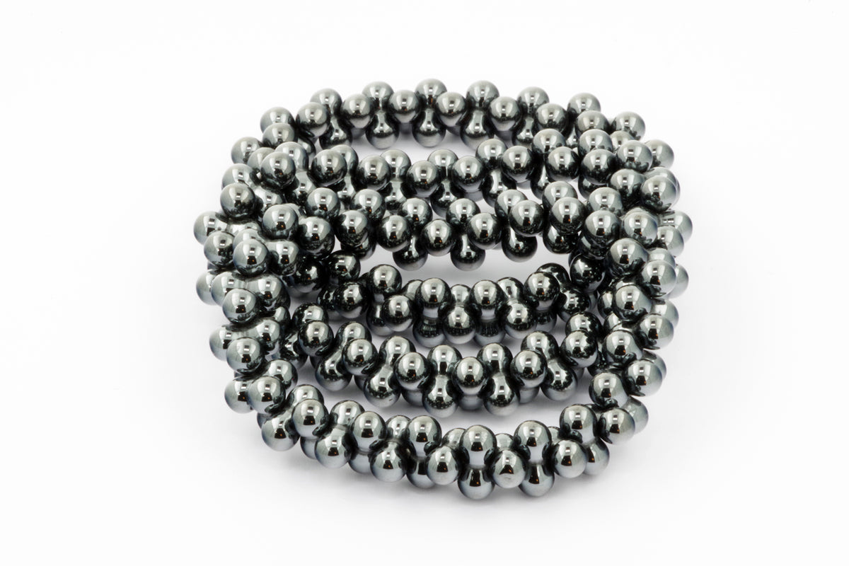 Hematite bracelet – DNA featuring polished round hematite beads arranged in a continuous strand, showcasing natural crystal properties with a metallic gray finish for grounding and healing energy.