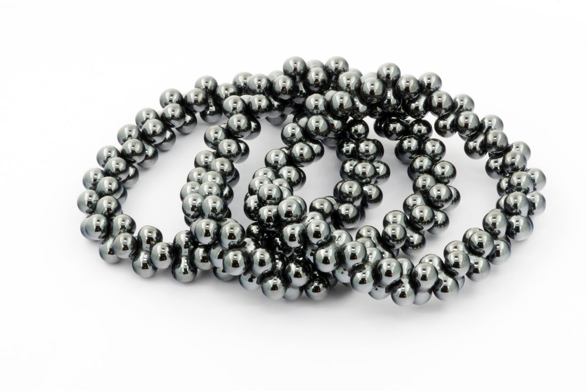 Hematite bracelet – DNA featuring polished natural hematite beads arranged in a sleek, reflective design, ideal for crystal bracelet collections and grounding energy.
