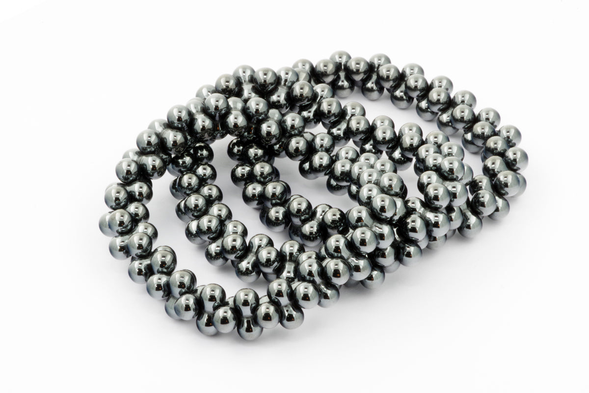 Hematite bracelet – DNA featuring polished natural hematite beads with a reflective metallic finish, ideal as healing crystal jewellery for grounding and energy balance.