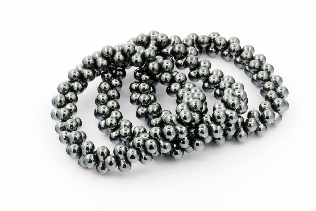 Hematite bracelet – DNA made of polished natural hematite beads strung together, showcasing a sleek metallic gray crystal bracelet ideal for grounding and healing energy.