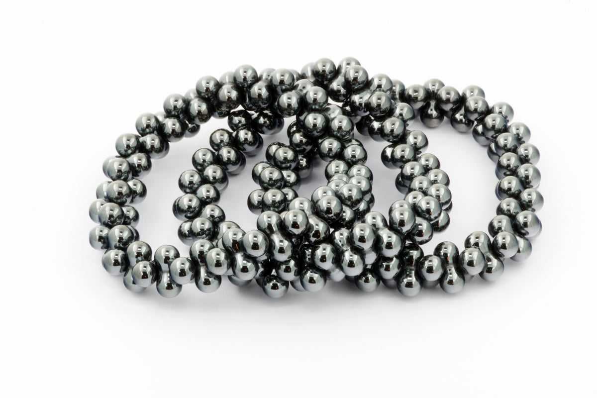 Stacked Hematite bracelet – DNA made of polished hematite gemstone beads with a smooth reflective surface, designed for grounding and energy healing crystal jewellery.