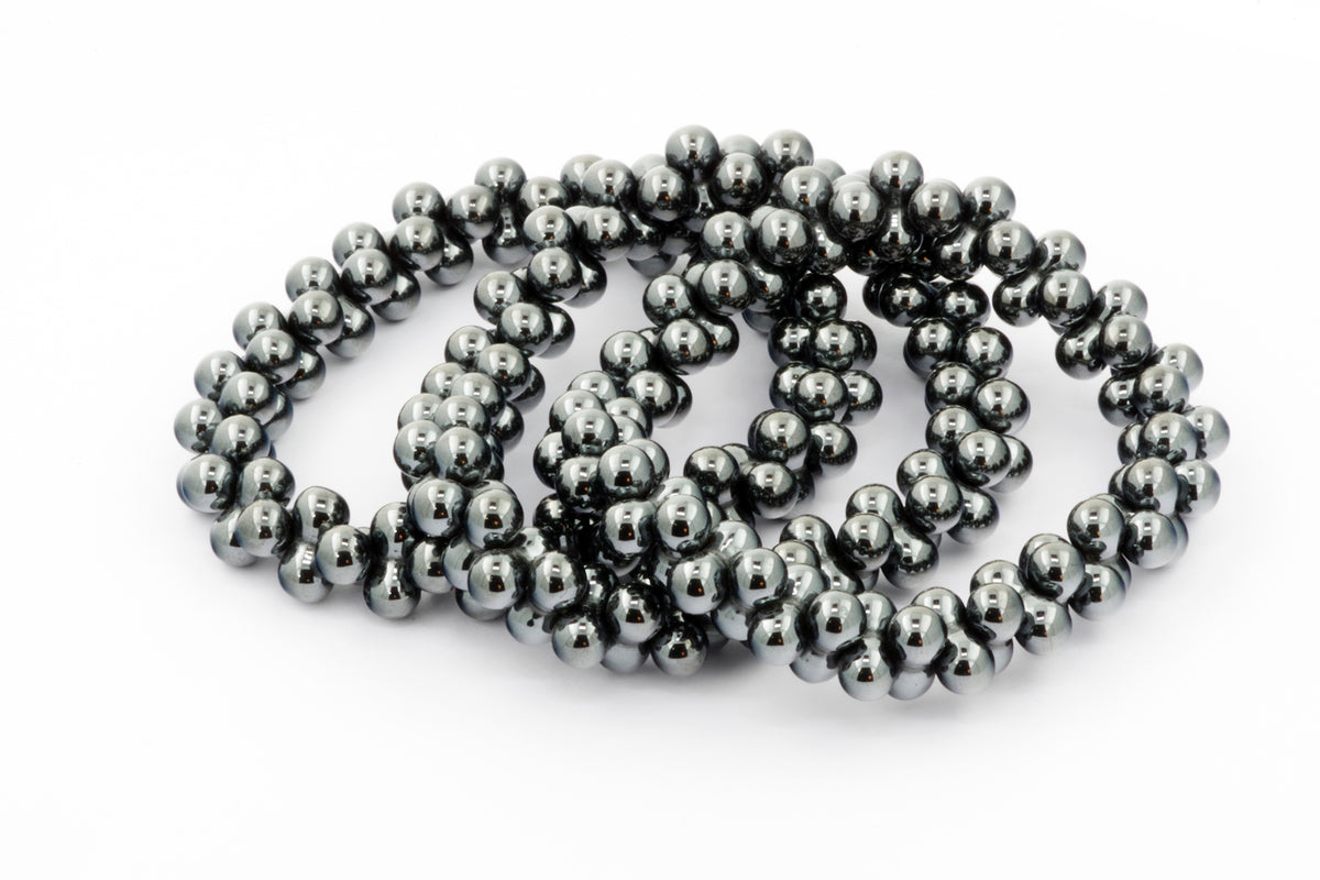 Hematite bracelet – DNA featuring polished dark metallic hematite beads strung together for a sleek and grounding crystal bracelet design.