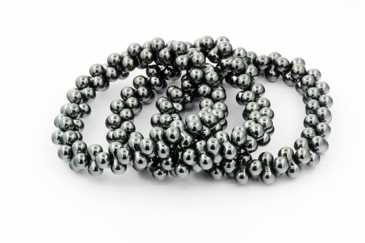 Hematite bracelet – DNA made of polished hematite beads with a reflective metallic gray finish, ideal for crystal jewellery lovers and healing crystals enthusiasts.