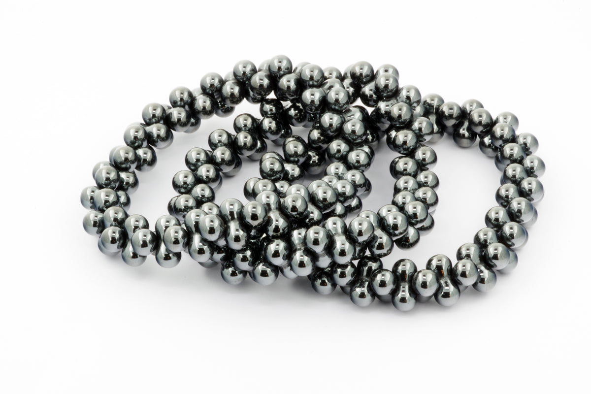 Hematite bracelet – DNA featuring polished dark grey hematite beads strung together, showcasing the natural metallic shine of crystal jewellery for grounding and healing energy.