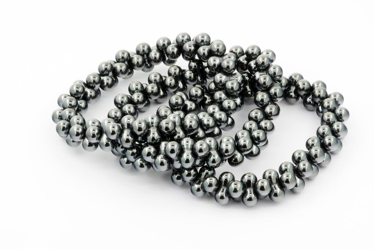 Hematite bracelet – DNA featuring polished hematite beads forming a sleek and modern crystal bracelet with a reflective metallic finish.