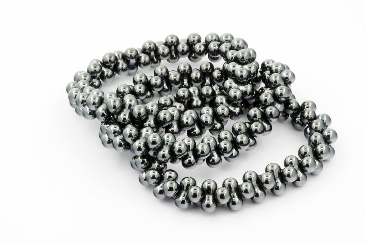Hematite bracelet – DNA featuring polished dark metallic beads arranged to resemble a DNA helix, showcasing natural crystals in elegant crystal jewellery design.