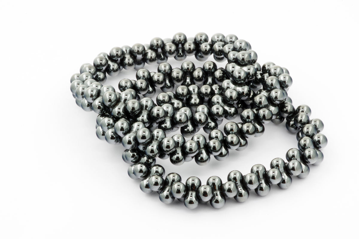Hematite bracelet – DNA featuring polished hematite beads strung together to create a smooth, reflective, and natural crystal jewellery piece for grounding and healing.