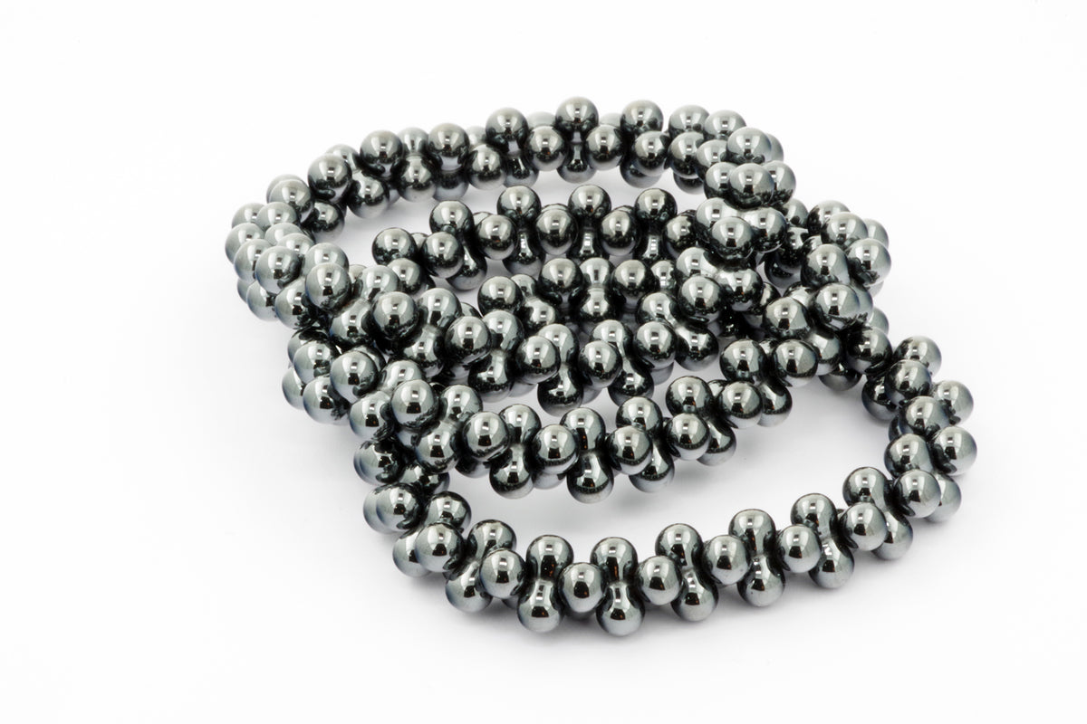 Hematite bracelet – DNA featuring polished dark metallic hematite beads arranged in a unique double helix-inspired design, perfect for crystal jewellery lovers.