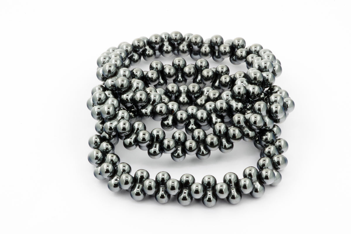 Hematite bracelet – DNA featuring polished hematite beads arranged in a unique DNA-inspired double helix design, combining natural crystals with modern elegance.