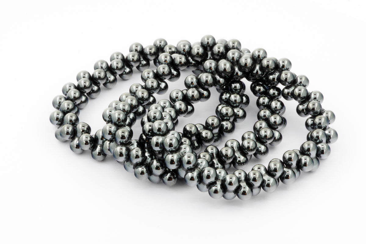 Hematite bracelet – DNA featuring polished dark metallic hematite beads arranged in a continuous loop, showcasing natural crystal jewelry with grounding and healing properties.