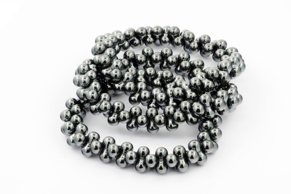 Hematite bracelet – DNA featuring polished hematite beads strung together, showcasing natural crystal properties with a smooth, metallic gray finish for a grounding and protective crystal bracelet.