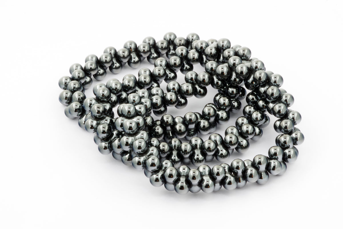 Hematite bracelet – DNA featuring polished dark metallic beads strung together, showcasing the unique natural sheen of hematite gemstones in a sleek crystal bracelet design.