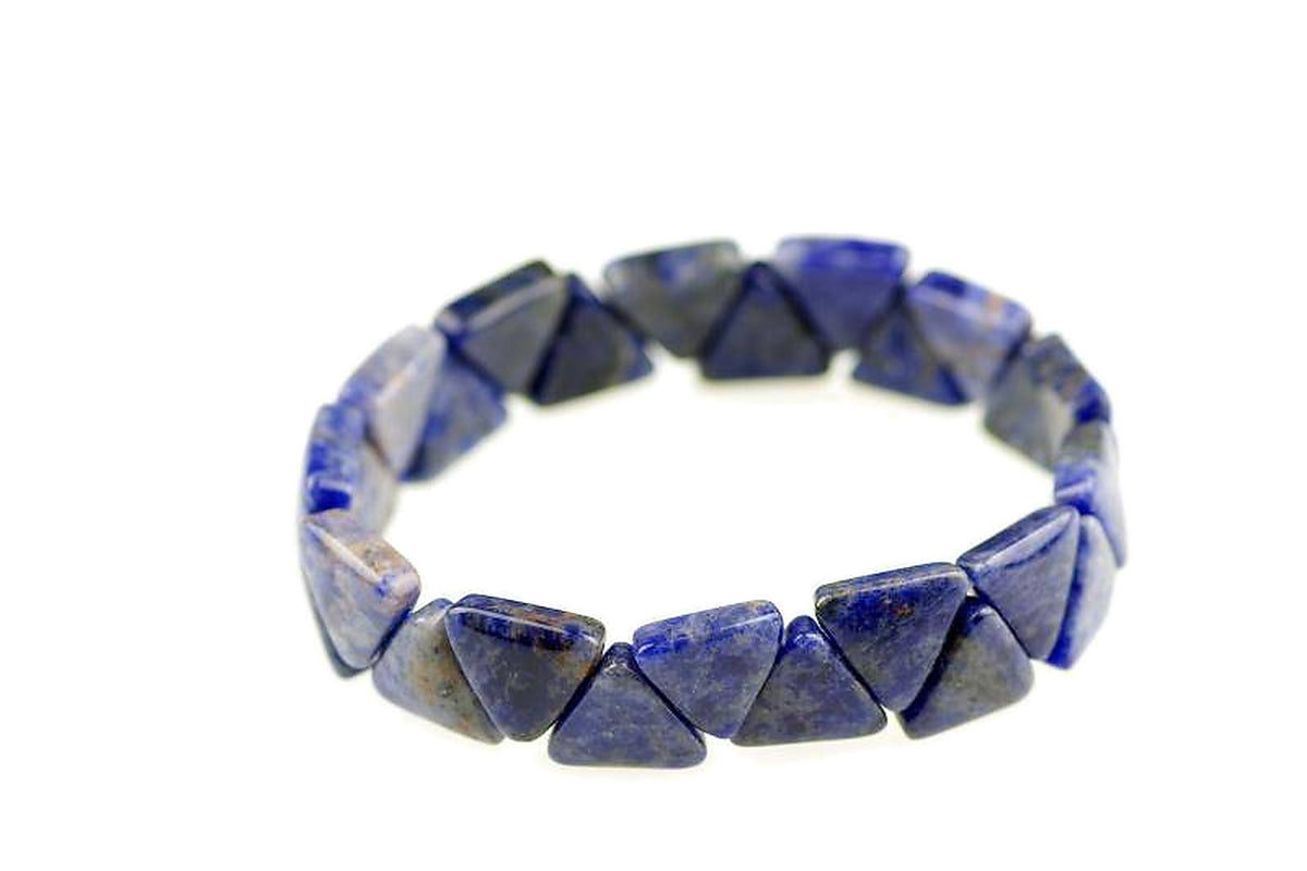 Sodalite bracelet – Triangle features polished natural blue sodalite gemstones cut into triangle shapes, strung together to create a stylish crystal bracelet for healing and meditation.