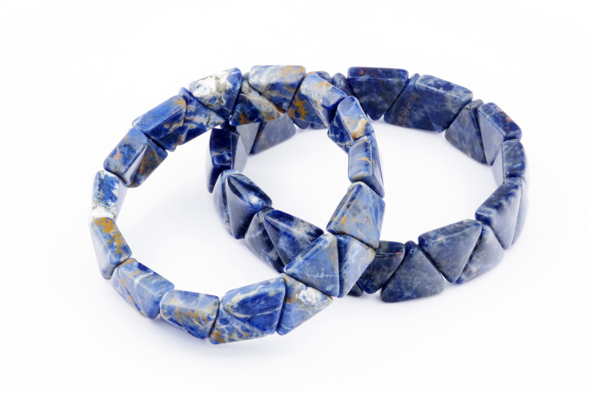 Two stacked Sodalite bracelet – Triangle made of polished blue and white natural crystals on a white background.