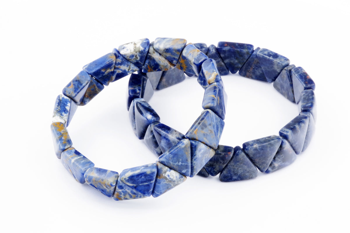 Two Sodalite bracelet – Triangle pieces made of deep blue natural crystal gemstones with characteristic white and gold vein patterns on a white background.