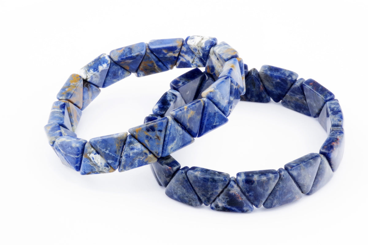 Two Sodalite bracelet – Triangle pieces made of polished natural blue crystals with white and brown mineral patterns on a white background.