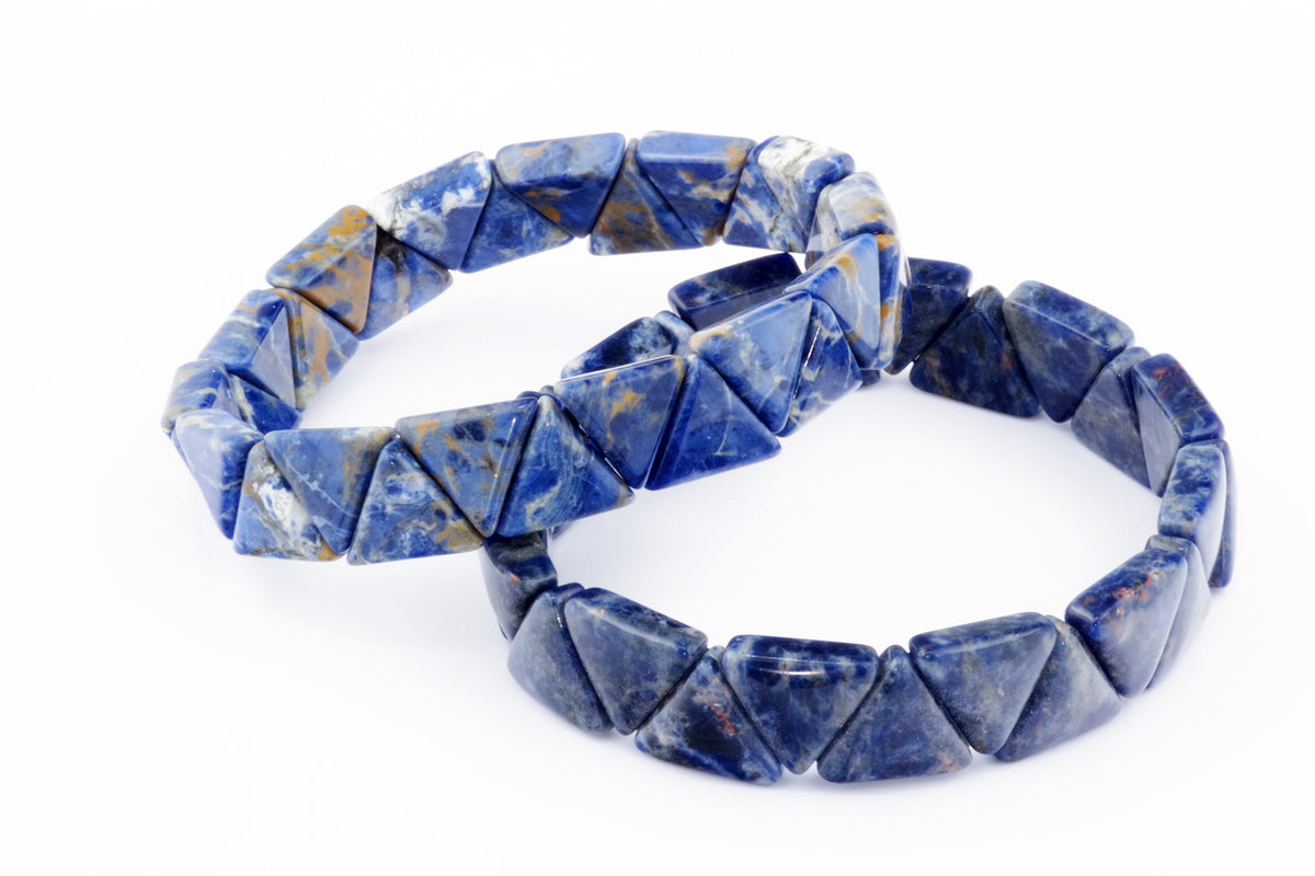 Two Sodalite bracelet – Triangle designs featuring polished blue and white natural crystals arranged in triangular shapes on an elastic band for crystal jewellery lovers.