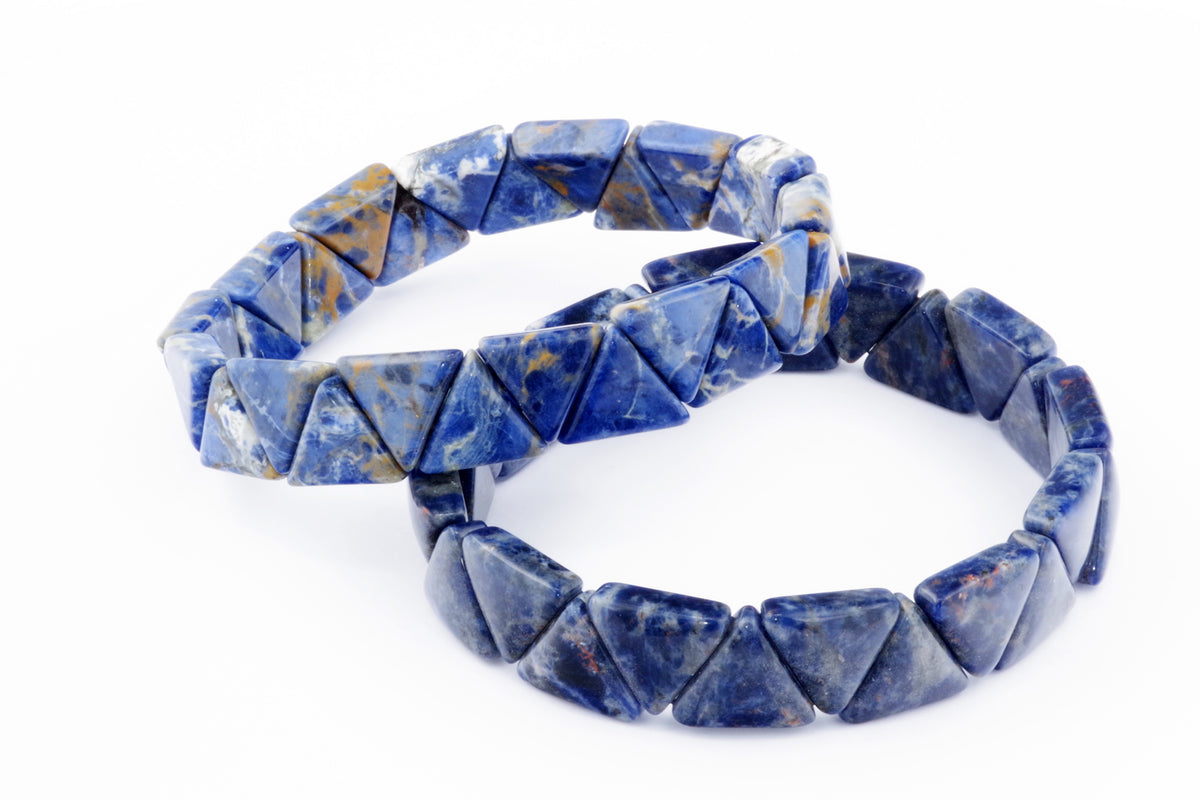 Two polished Sodalite bracelet – Triangle pieces made of blue natural crystal gemstones arranged in triangular shapes on a clean white background.