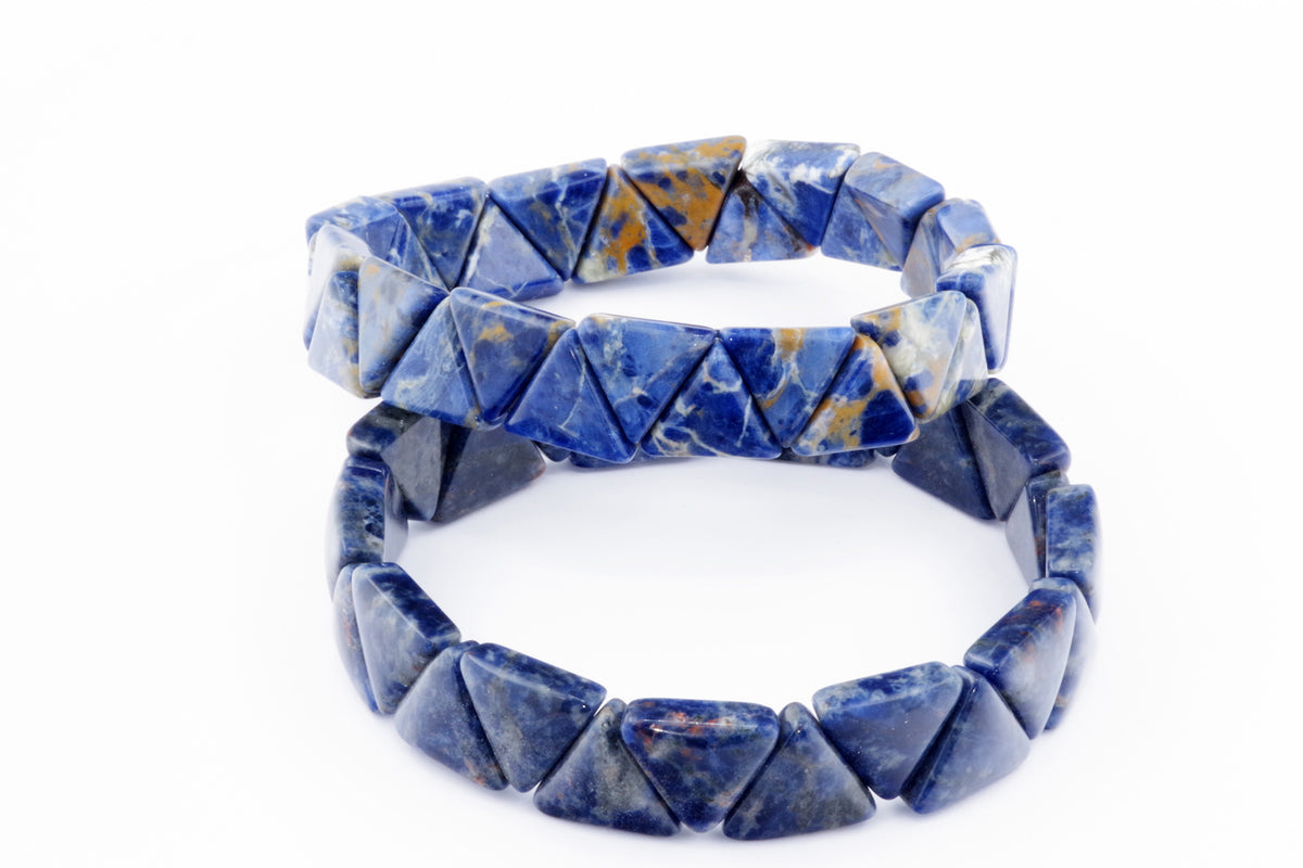 Two Sodalite bracelet – Triangle designs featuring natural deep blue and white crystal gemstones with orange-brown inclusions, polished into geometric triangular shapes for crystal jewellery lovers.
