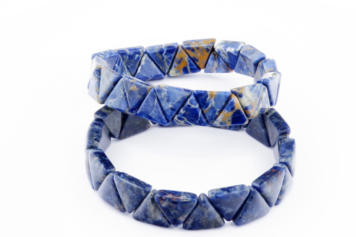 Two Sodalite bracelet – Triangle designs featuring polished blue and white natural crystal triangle beads arranged on elastic bands against a white background.