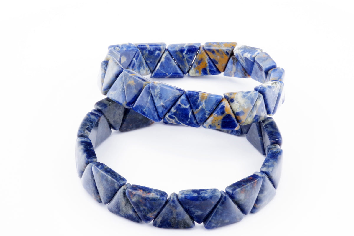 Two Sodalite bracelet – Triangle bands featuring polished blue and white gemstone triangles arranged in a geometric pattern, showcasing natural crystal hues and textures.