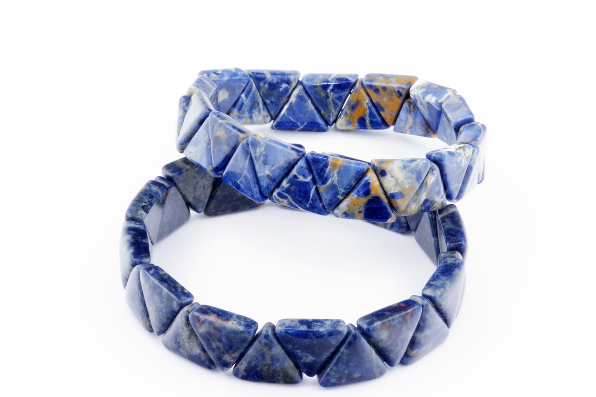 Two polished crystal bracelets made of blue sodalite gemstones, arranged in a circular shape with pyramid-like triangle beads, known as Sodalite bracelet – Triangle.