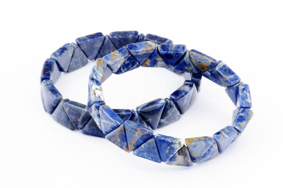 Two Sodalite bracelet – Triangle pieces featuring polished blue and white natural crystal gemstones arranged in triangular shapes on a white background.