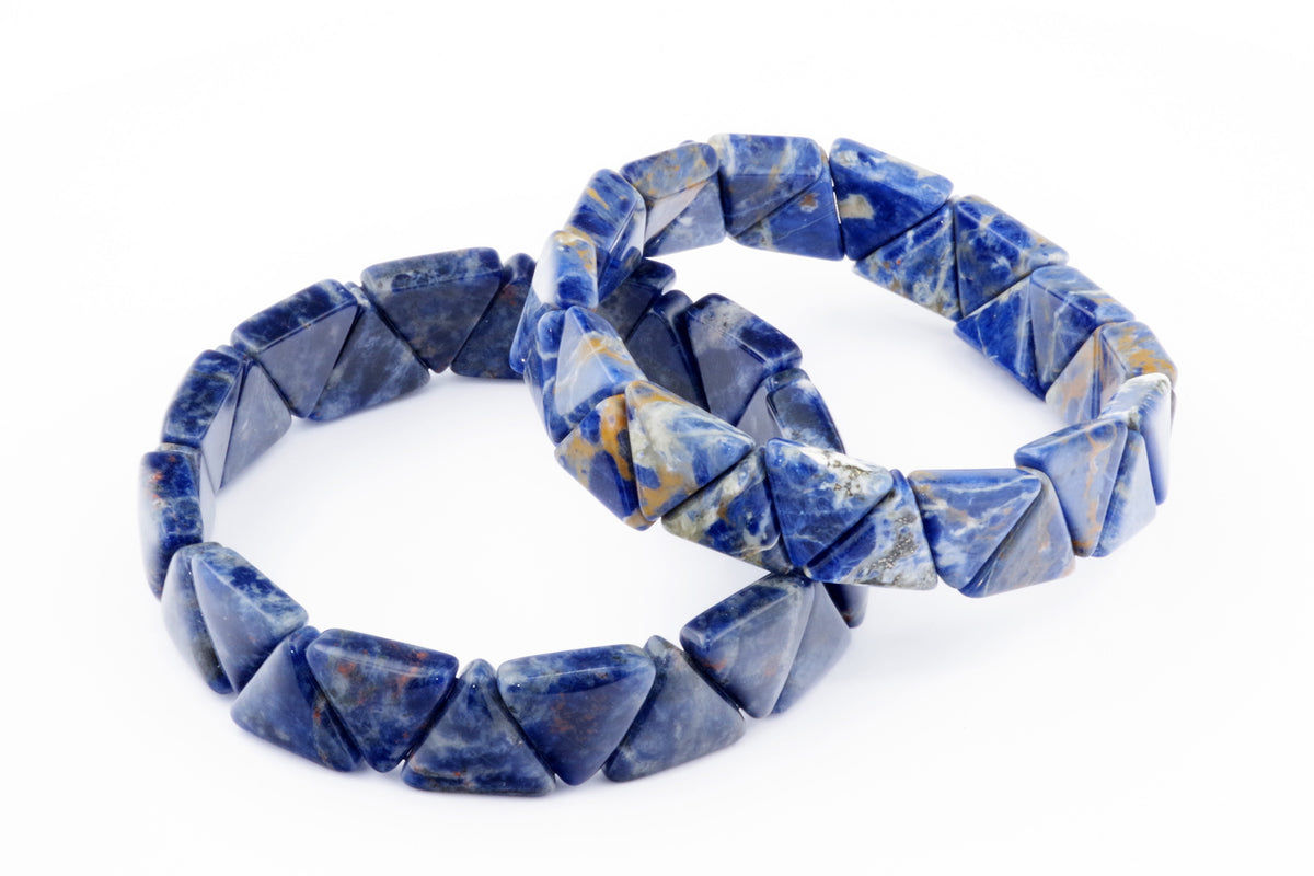 Two natural crystal Sodalite bracelet – Triangle pieces featuring polished blue stone triangles with white and brown mineral patterns, designed as elegant crystal jewellery.