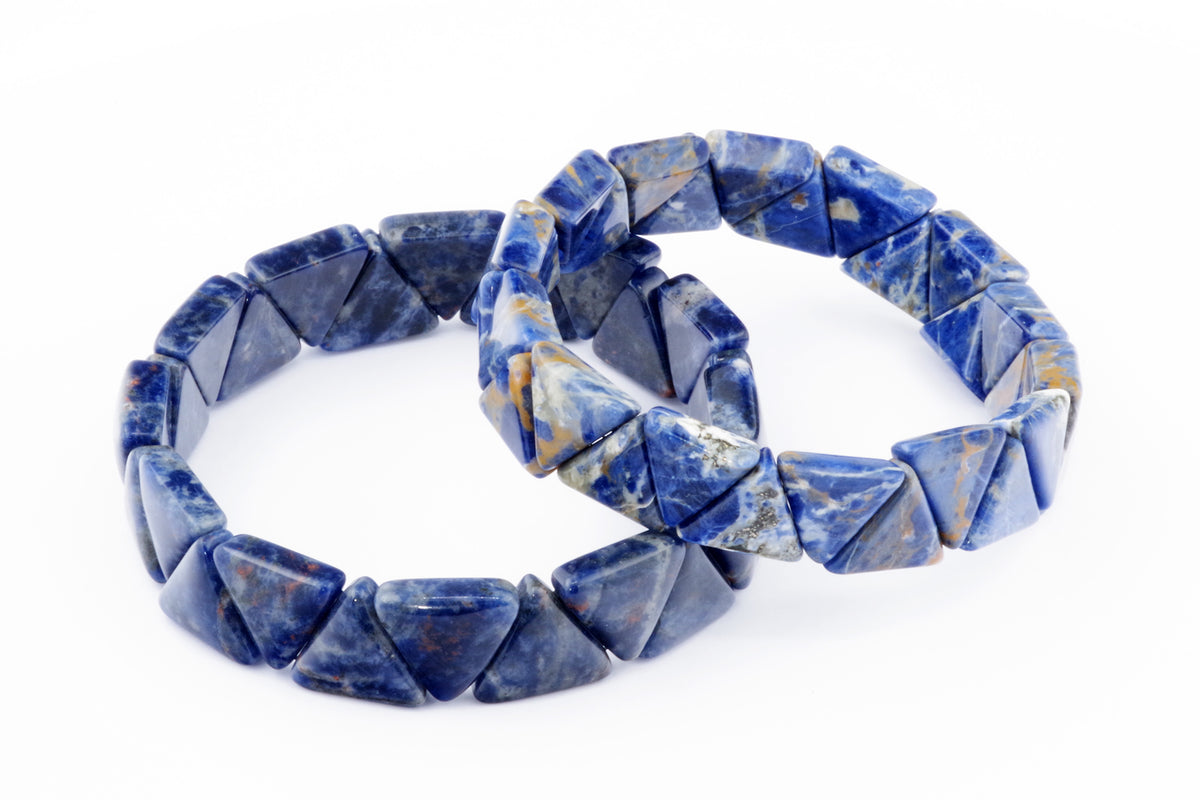 Two Sodalite bracelet – Triangle pieces featuring polished deep blue and white patterned triangular natural crystal gemstones arranged on an elastic band