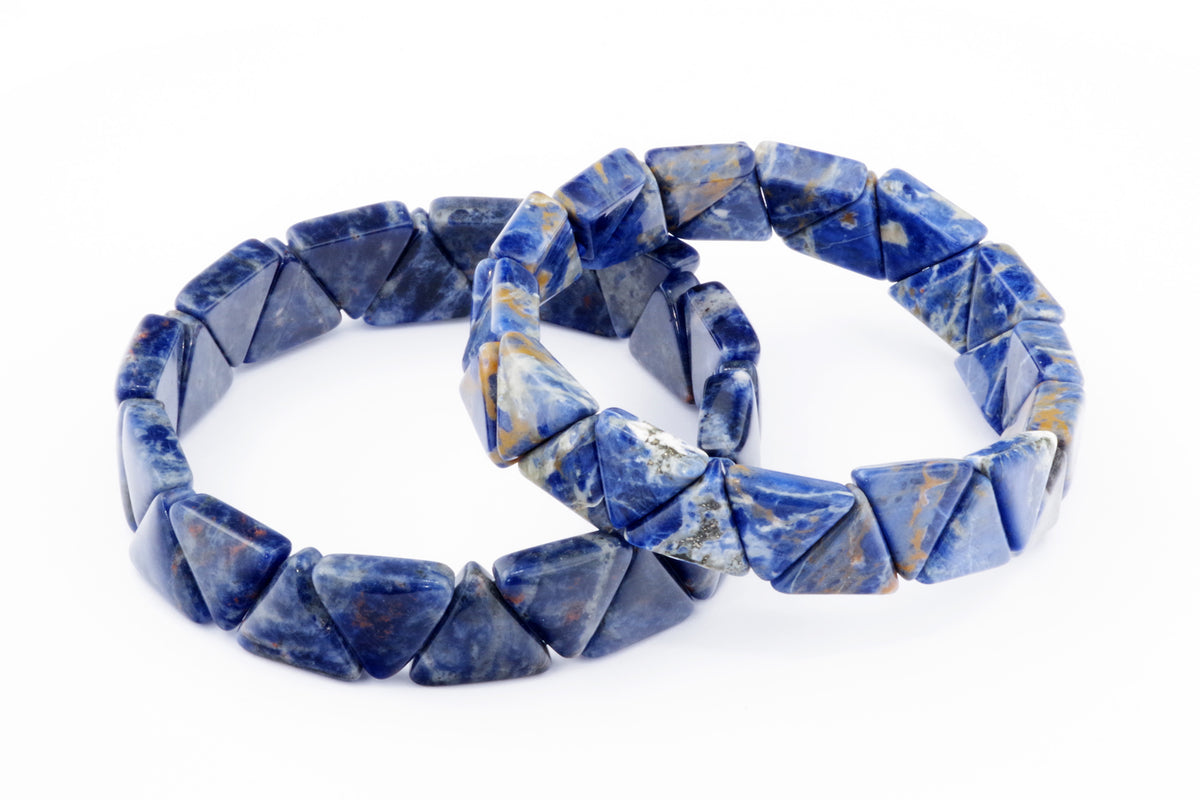 Two sodalite crystal bracelets made of polished triangle-shaped gemstones, showcasing deep blue and white natural crystal patterns, named Sodalite bracelet – Triangle.