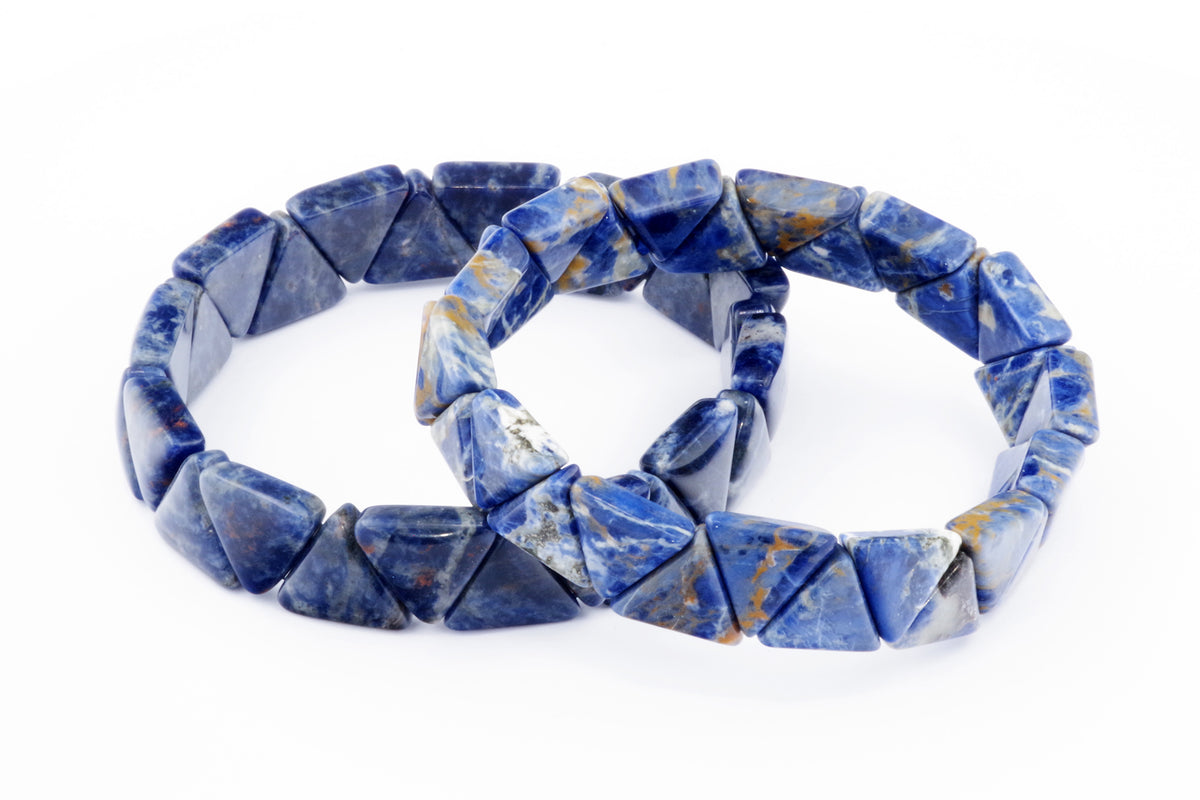 Two Sodalite bracelet – Triangle pieces featuring polished deep blue natural crystals with white and orange mineral accents arranged in a geometric design.